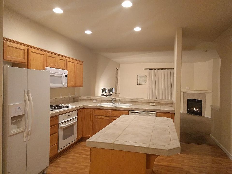 Gas range, gas water heater, gas furnace, gas fireplace. This is an end unit so there are extra windows on all floors and gated side access to fenced yard plus an inside garage door to back yard.