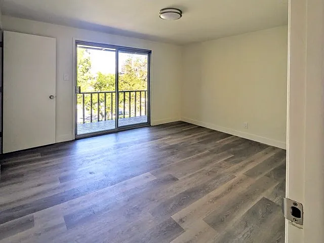 Spacious Master Bedroom Featuring Private Deck and Two Closets
