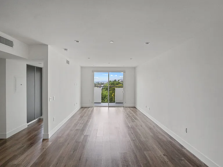 Living Room with Patio, Recessed Lighting, and Vinyl Flooring