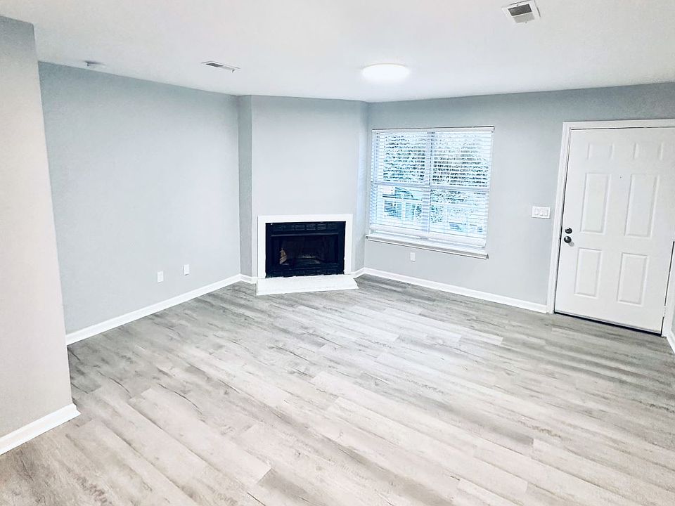 Living room with vinyl flooring and freshly painted