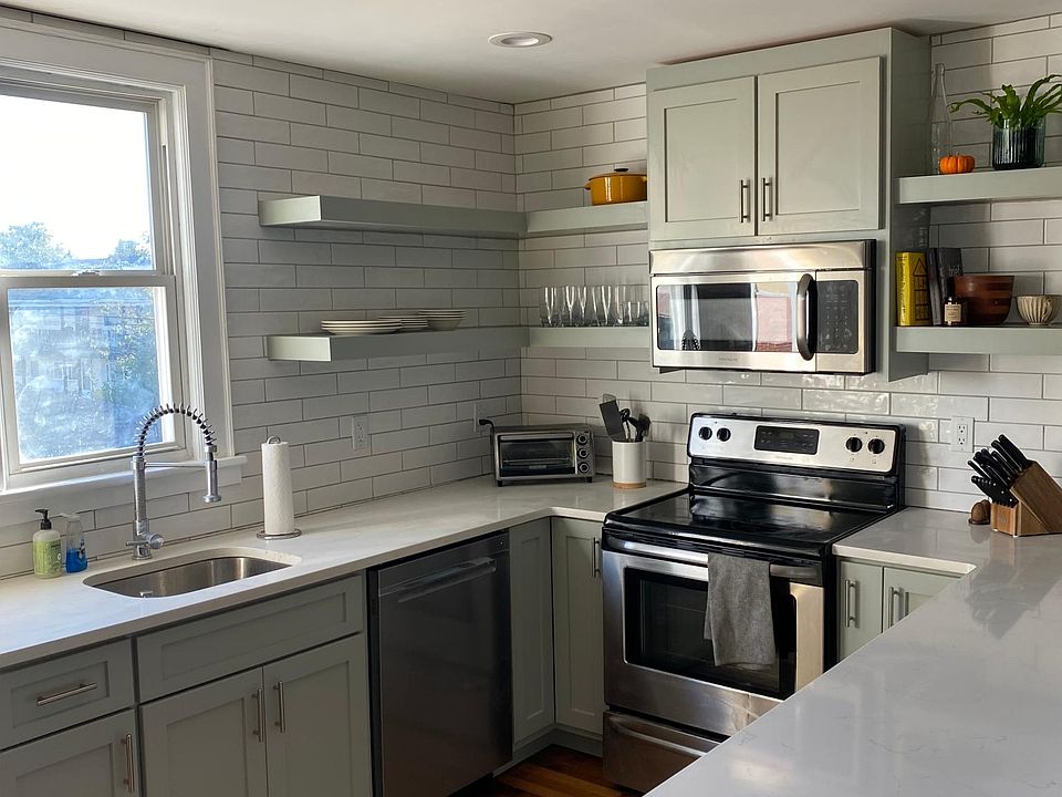 Completely rennovated kitchen with plates, utensils, glassware, pots & pans provided.