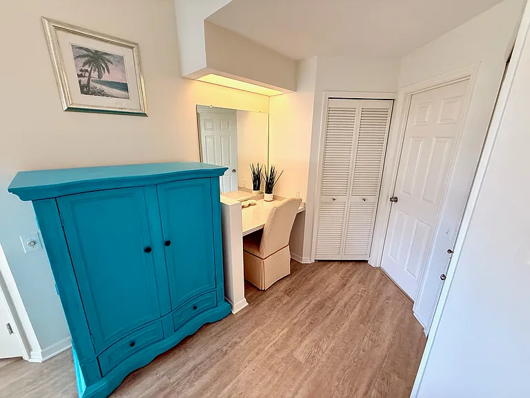 Primary vanity with 2 walk in closets and bathroom.