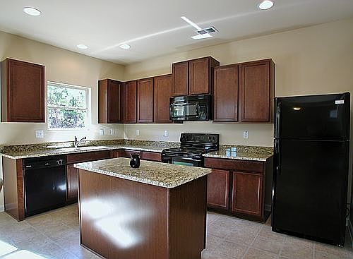 Granite countertops, hardwood cabinets, recessed lighting