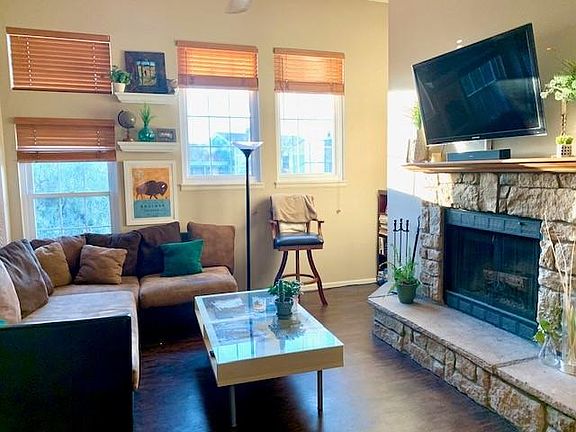 Bright living room with wood burning fireplace