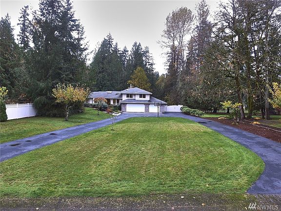 Large front yard and circular driveway