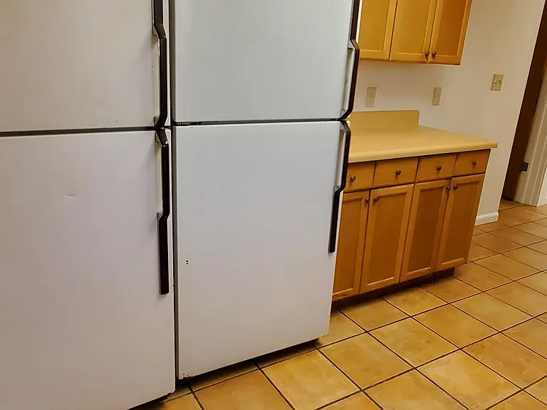 kitchen area. 2 refrigerators