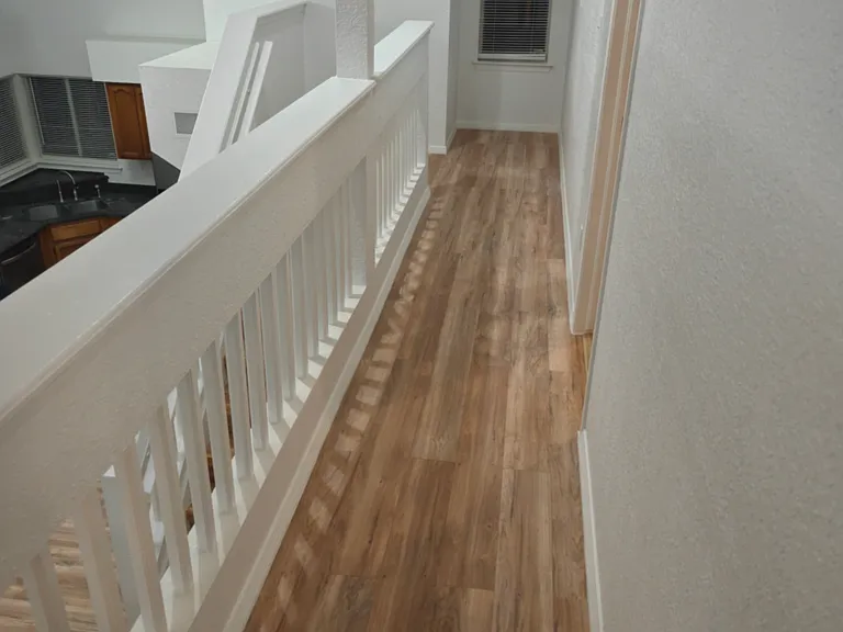 Upstairs hallway connects master to secondary bedroom.