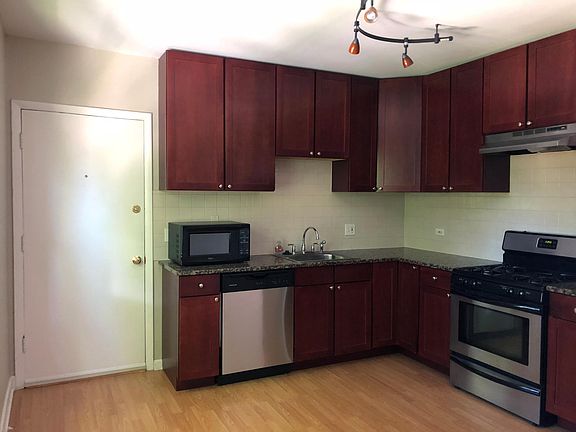 Kitchen 15' x 12' - Exit door to Washtenaw Ave. Gas Stove, Dishwasher, Microwave and Garbage Disposal.