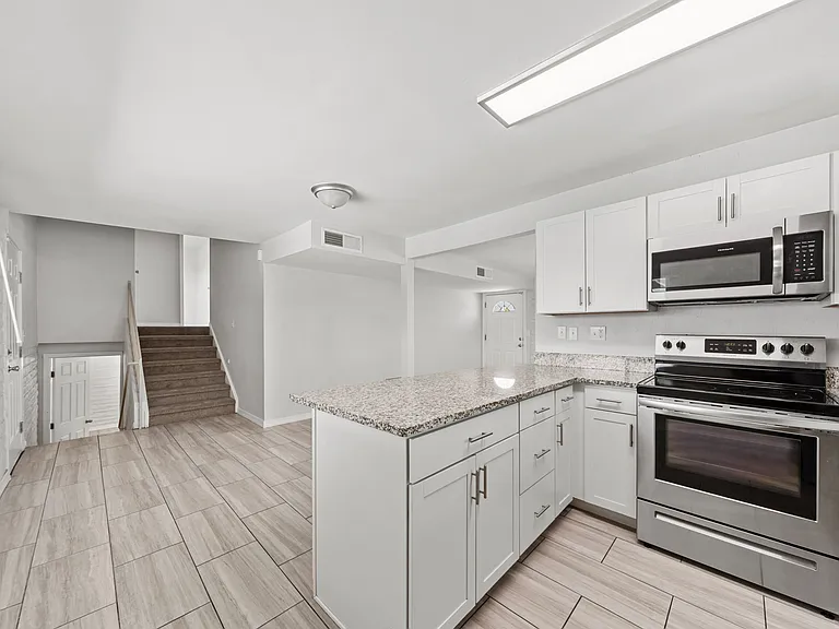 Unique split-level layout, stairs lead up to three bedrooms and down to one, giving everyone their own space.