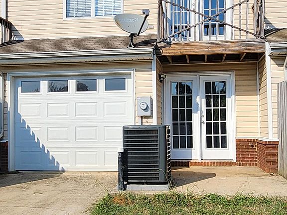 Rear - 1 car garage and patio
