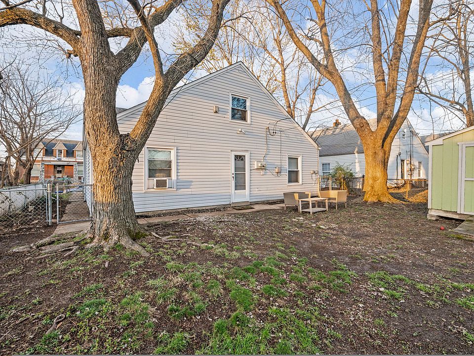 Rear of property. Wooded. Fenced yard.