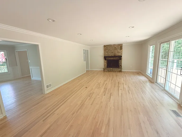 Bright and open main floor living area connected to dining room and kitchen