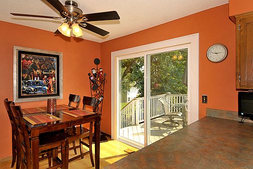 Eat-in dining space in kitchen enjoys lots of light through new patio door