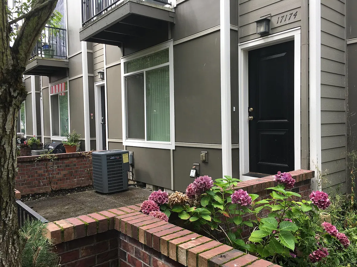 Front Entrance with gated, bricked in private patio great for summer barbeques. - 17174 SW Whitley Way