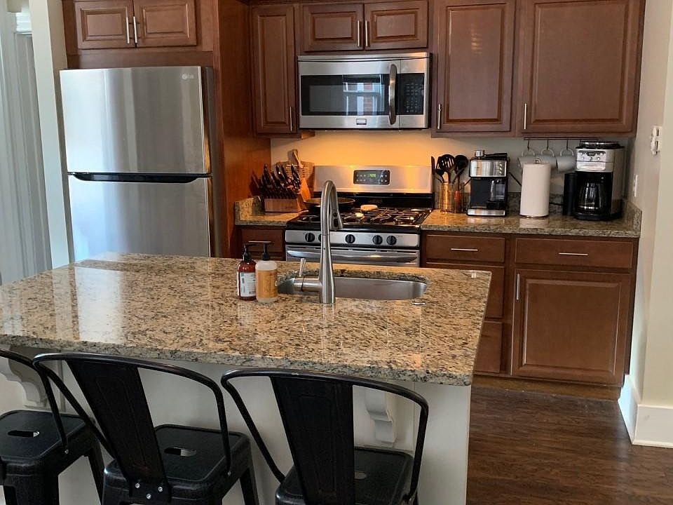 Beautiful open plan kitchen with granite counters & stainless steel appliances