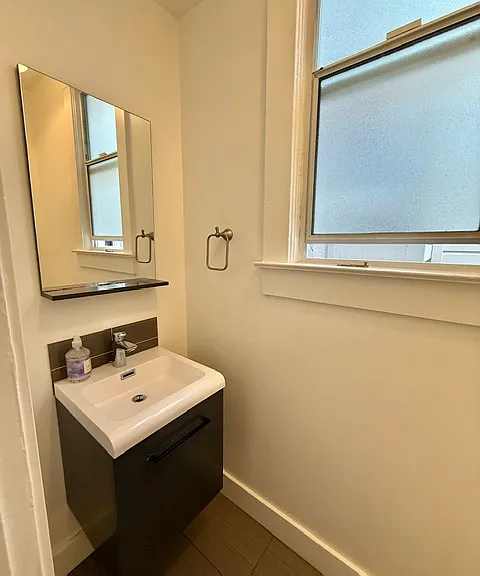 Half bath with toilet and sink
