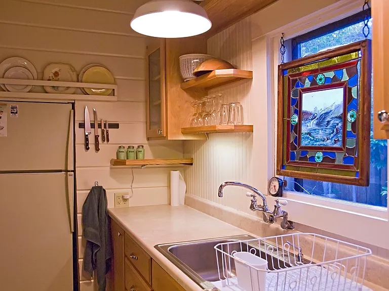 Kitchen with built-n refrigerator on the Left.