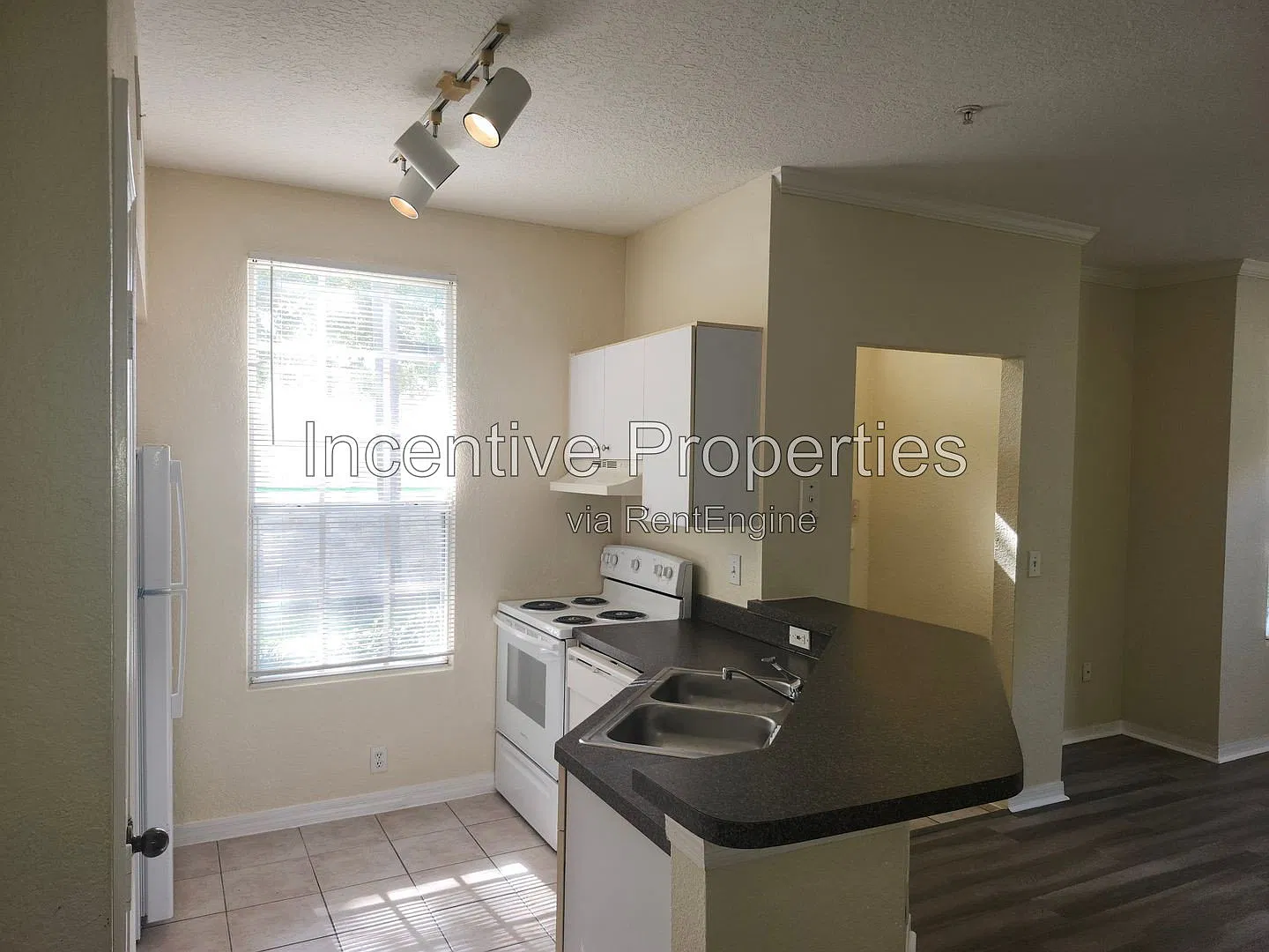 6372 Raleigh St — Photo 3