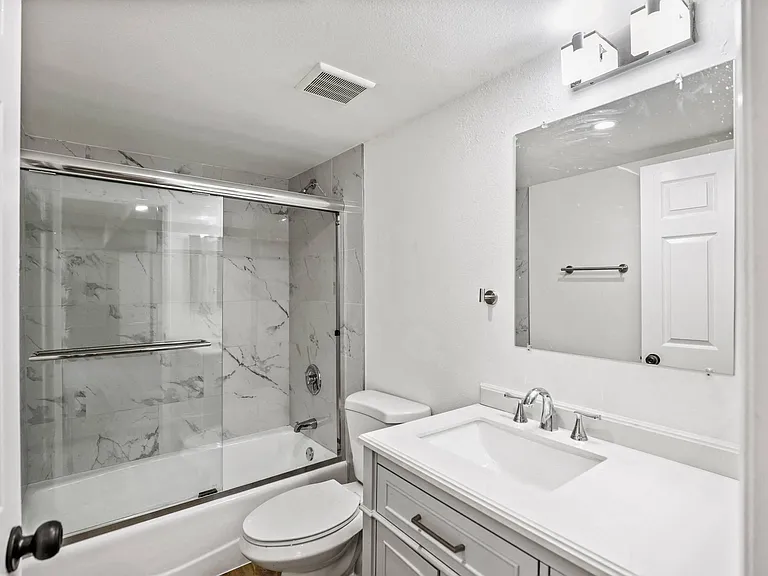 Bathroom with Bathtub with Glass Doors