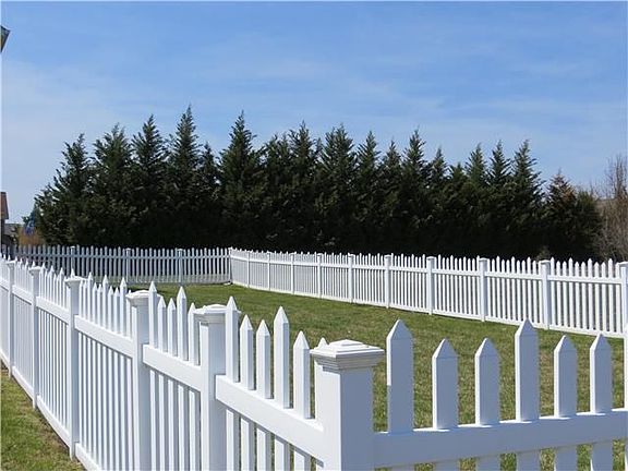 Large fenced yard for pets or swingset