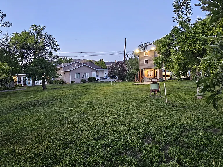 Lots of grass, fruit trees, dart board and great lighting.