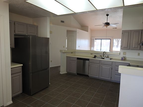 The kitchen is designed with ample space.
