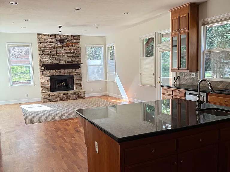 Kitchen and family room accessed through garage entry and door from sideyard
