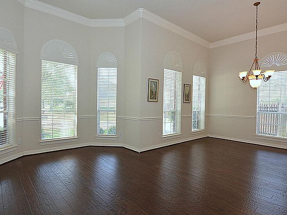 12 foot ceilings, chair board, chandelier and crown molding.