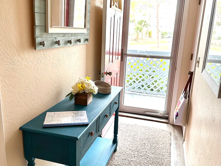 Your retreat starts at the front door. __ We've put thought into every detail to ensure you feel invited from the second you arrive. With clean lines and coastal touches, this entryway is just the beginning of your Fiddler's Green adventure.