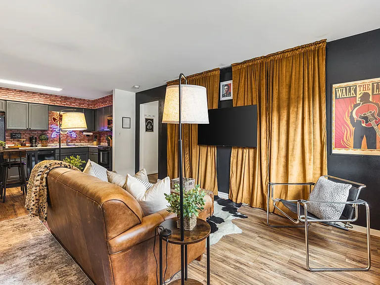 Cozy living room with a smart TV and a sleeper sofa. No stairs in this condo and located on the ground level, for easy access.