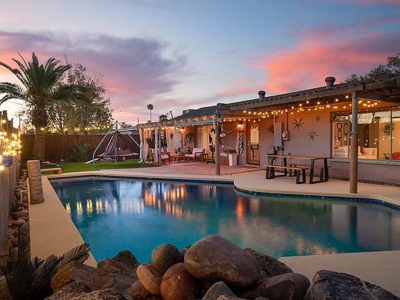 Sparkling clean Pebble Tech pool with a depth that goes from 3' to 8'.