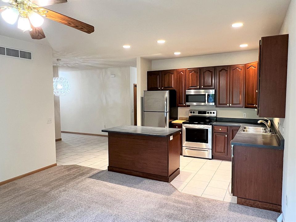 Open concept floorplan (photos are of comparable unit; available unit has Oak cabinets)