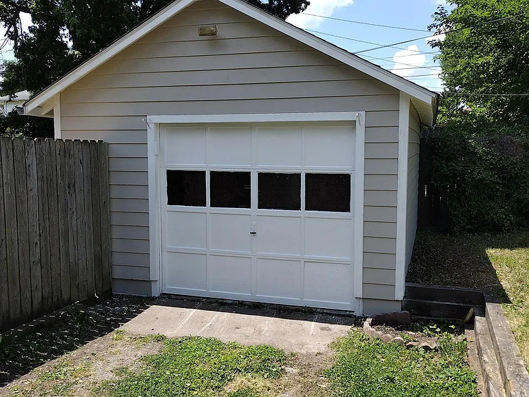 1 car garage with some storage capacity. Garage door works wihin remote.