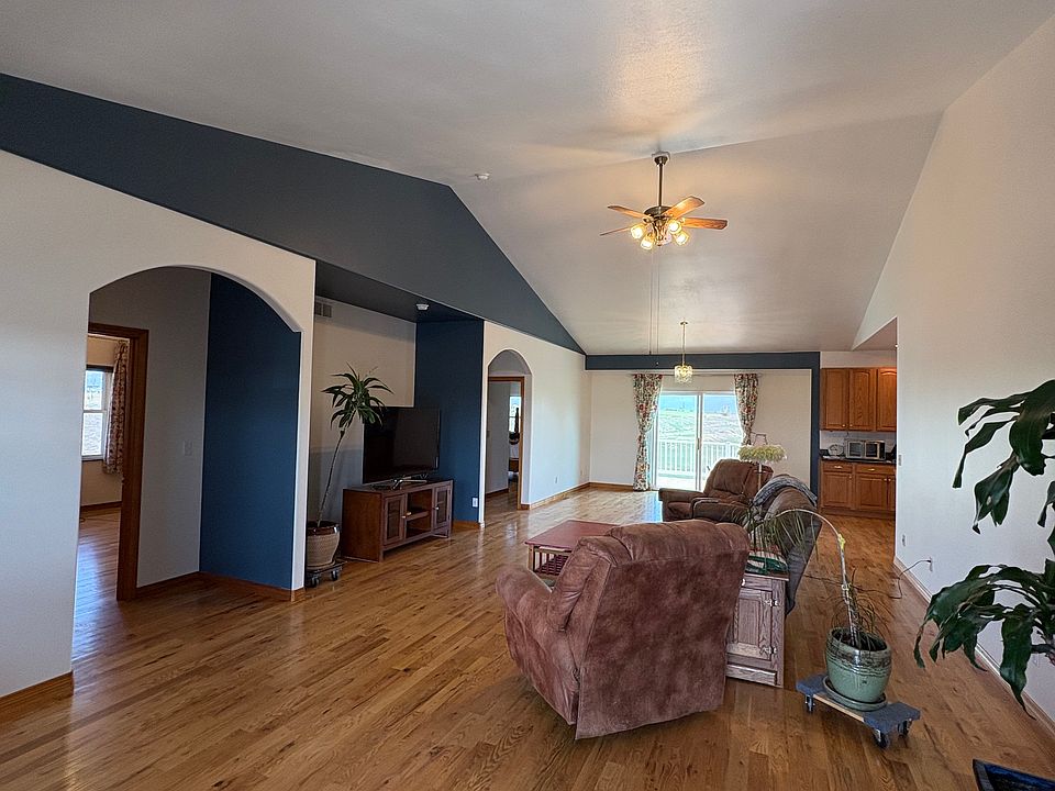 freshly painted huge living / dining room with cathedral ceilings.