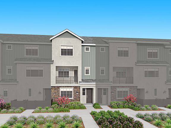 The image depicts a multi-story residential building with a gray exterior, featuring a landscaped fr