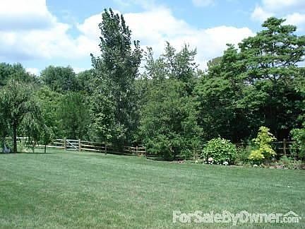 PUT YOUR POOL HERE!
						:
						Lovely back yard is mostly level, fenced, and landscaped. Like being at the park
