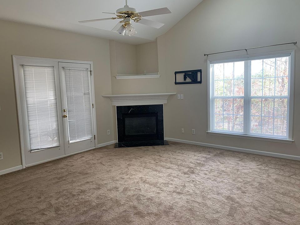 Living room with gas fireplace and wall mount for TV