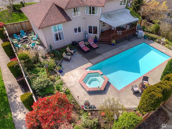 From this view you can see how lovely this property is- firepit area, pool, hot tub, covered deck & lots of patio