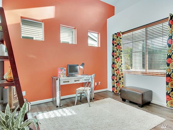 High vaulted ceilings in the den/office w/ double french door entry.