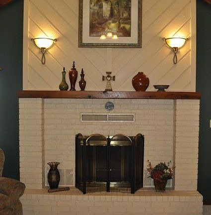 ..a gas log insert and large mantle