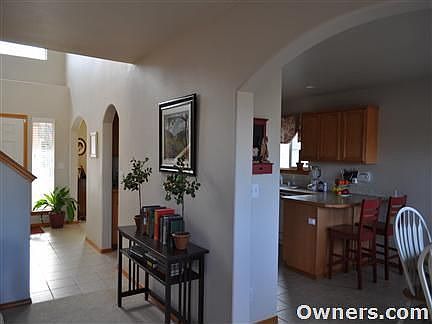 View of Entry and Kitchen from Living Room.