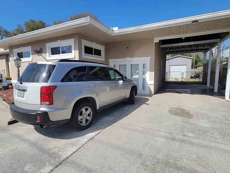 Parking space in front of the French doors for convenient access.