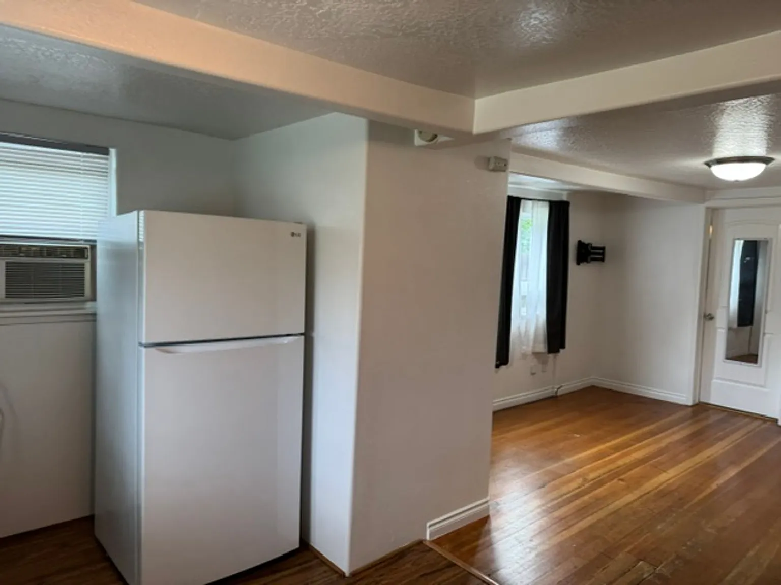 Bright & Updated Studio One-Level Living with Landscaping Included! — Photo 4