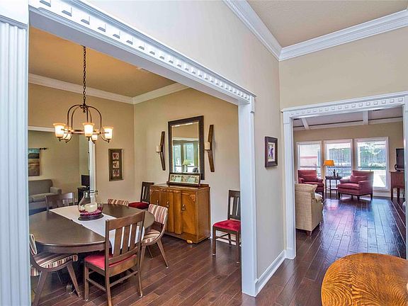 Appreciate the mill work in this home... fluted trim, 6" baseboards, dental molding and double-crown... an elegant entrance for your guests. Gaze to the back of the home and you'll find the trim continues... the family room windows have beautiful cas