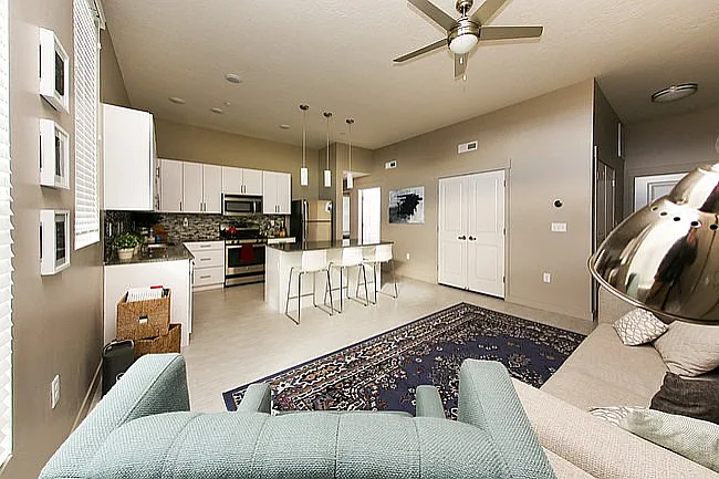 Experience modern elegance in this chic open-concept living area, perfect for entertaining and relaxation.