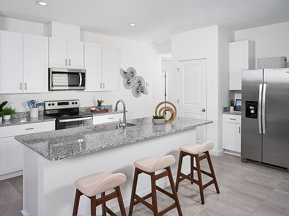 Kitchen of the Olympic plan modeled at Lakes at Bella Lago.