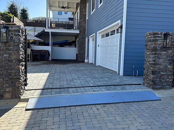 Covered off street parking and patio area