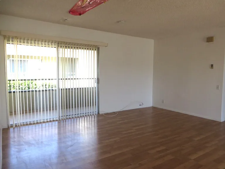 Living room and Glass doors to the left Balcony from door entrance