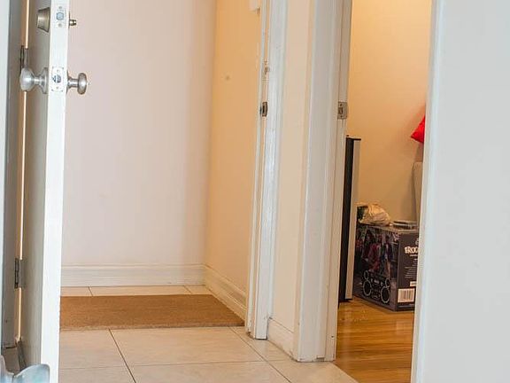 from the garage, entrance into the townhome and to the right is the entrance to the bonus room. (not part of the 4 bedroom layout, this is an extra room)