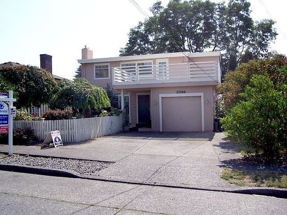 Front view of the home, notice off-street parking for 2 cars plus 1-car garage